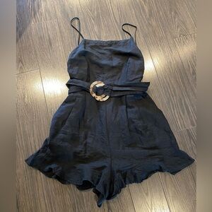 Ruffled black romper with belt - 55% linen